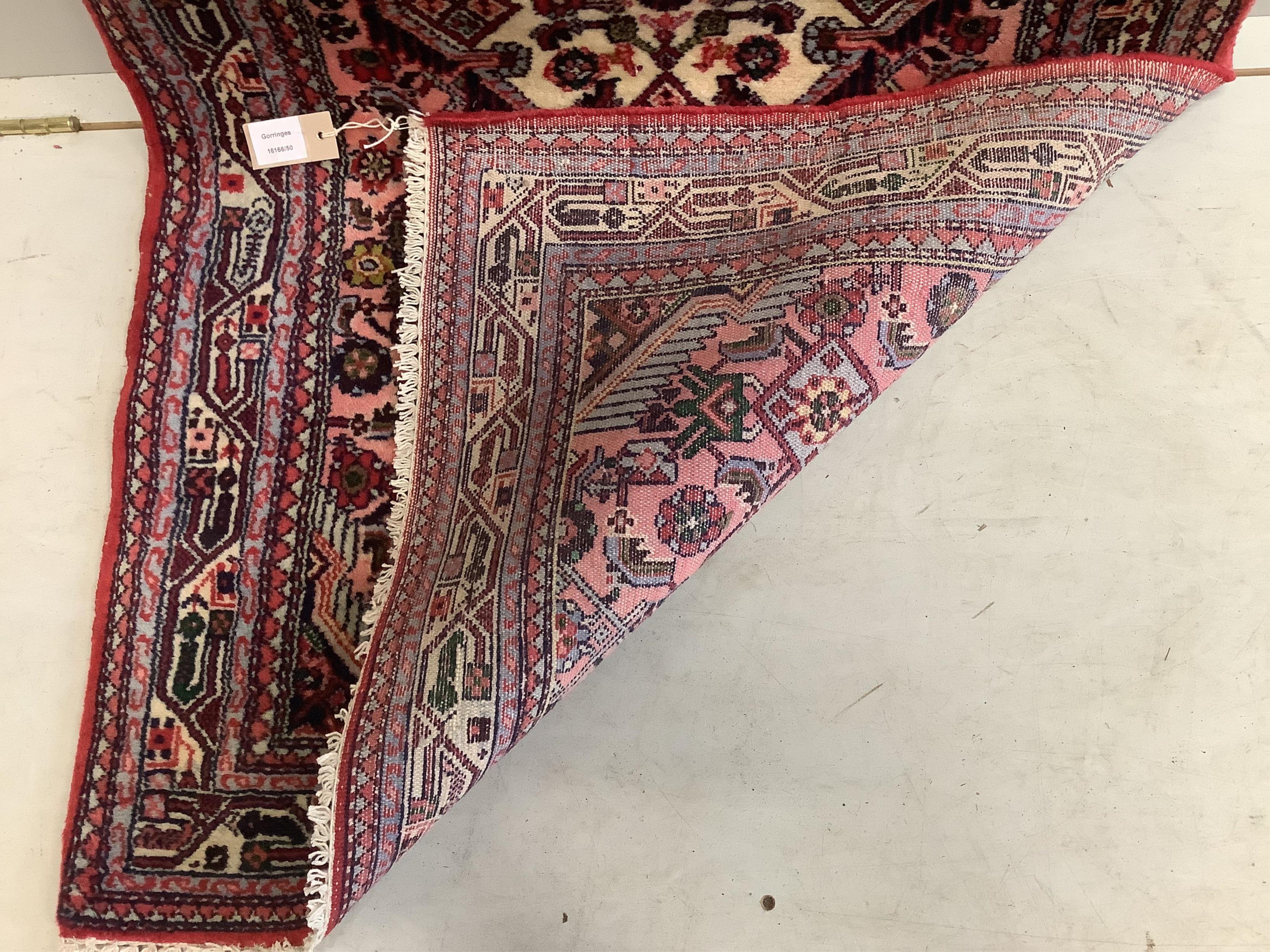 A North West Persian pink ground runner, 290 x 82cm. Condition - good